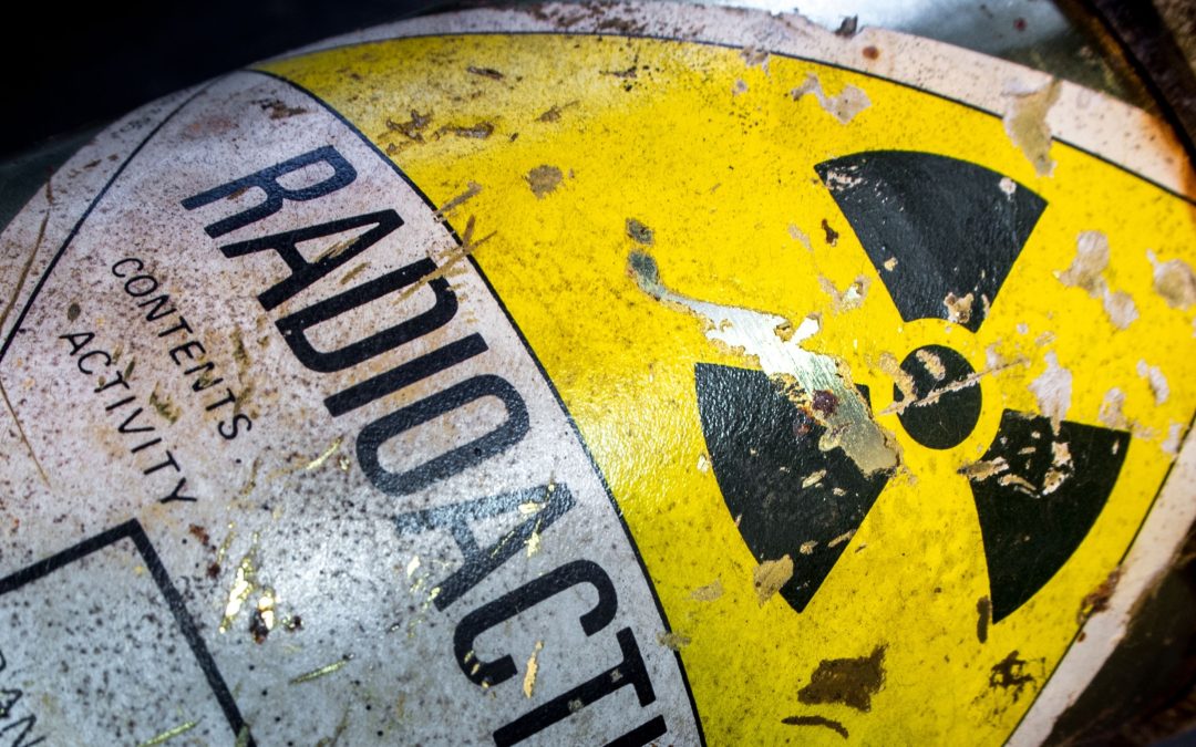 Well worn radioactive transport Yellow label on a container.